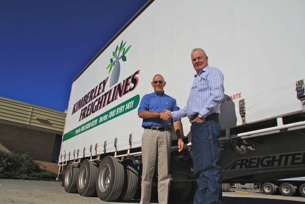 Freighter's Mike Dawson handing over some very hard-working trailers to John Kendrick. Freighter's Mike Dawson handing over some very hard-working trailers to John Kendrick.